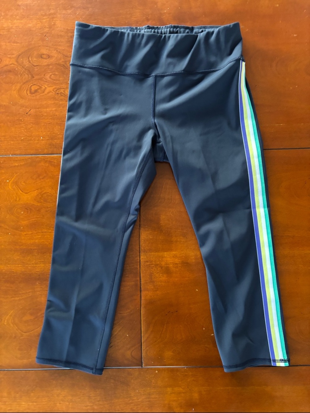 Athleta Navy Capri Leggings with Blue, Green & Yellow Side Stripes.  Like New. M
